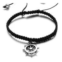 Kép 1/4 - Black Wolf - Fekete Fonott Paracord Karkötő - Acél Hajókormány Medál