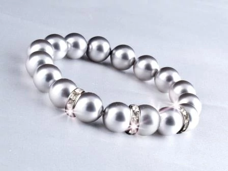 Eredeti Swarovski® Szürke gyöngyökből készült karkötő, valódi, fehér Swarovski®  kristállyal díszített rondellákkal